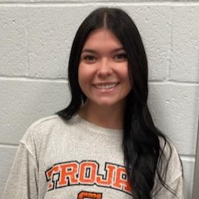 young lady with long black hair wearing a gray Trojan Nation sweatshirt