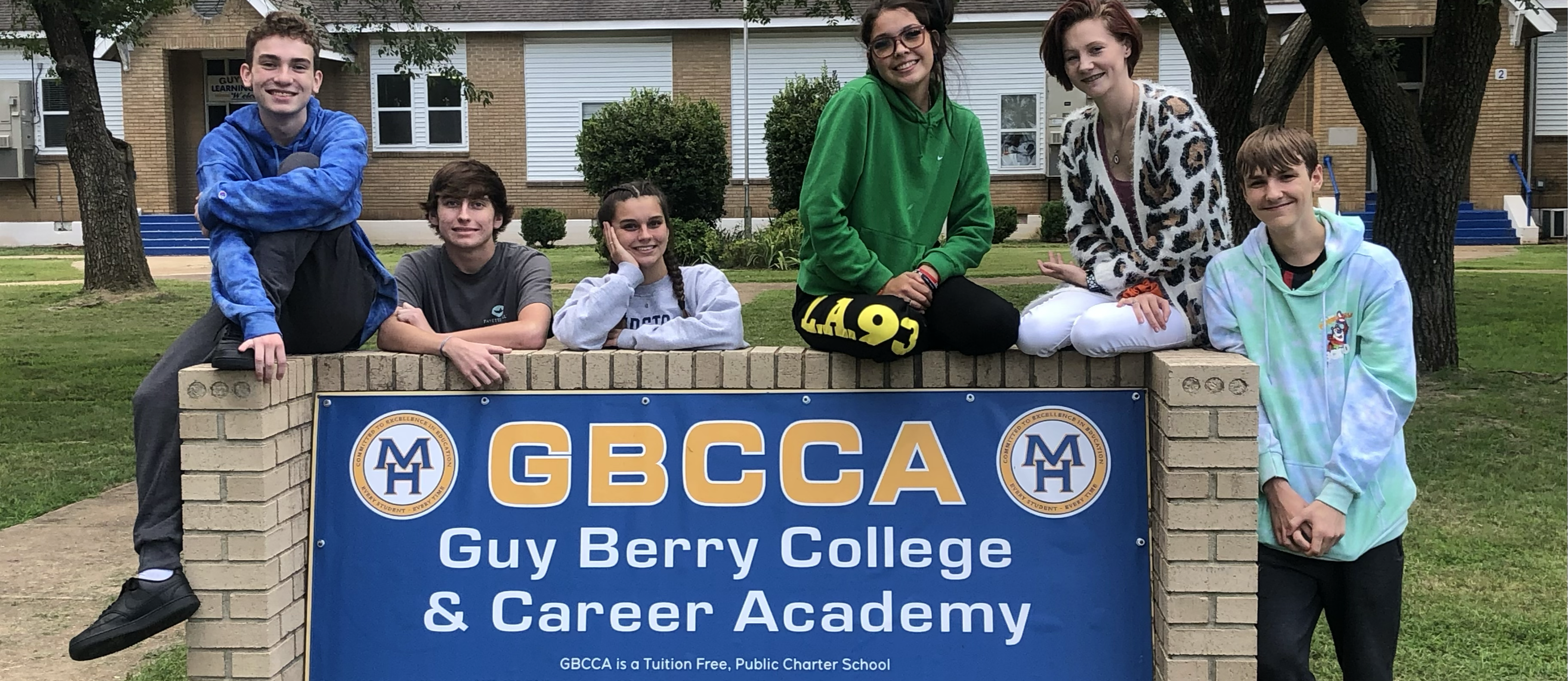 kids standing in front of new GBCCA sign