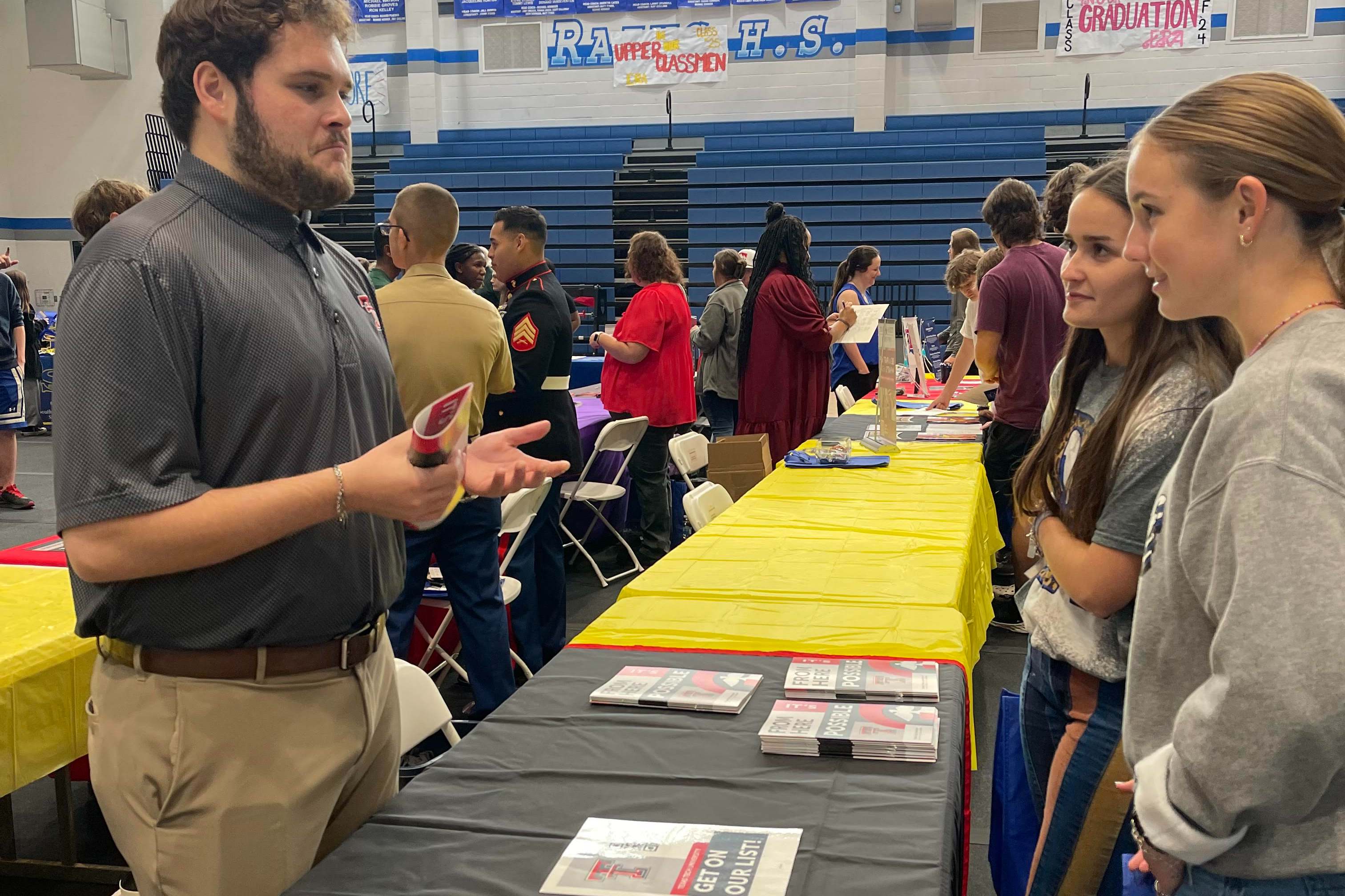 students talking to college rep from Texas Tech