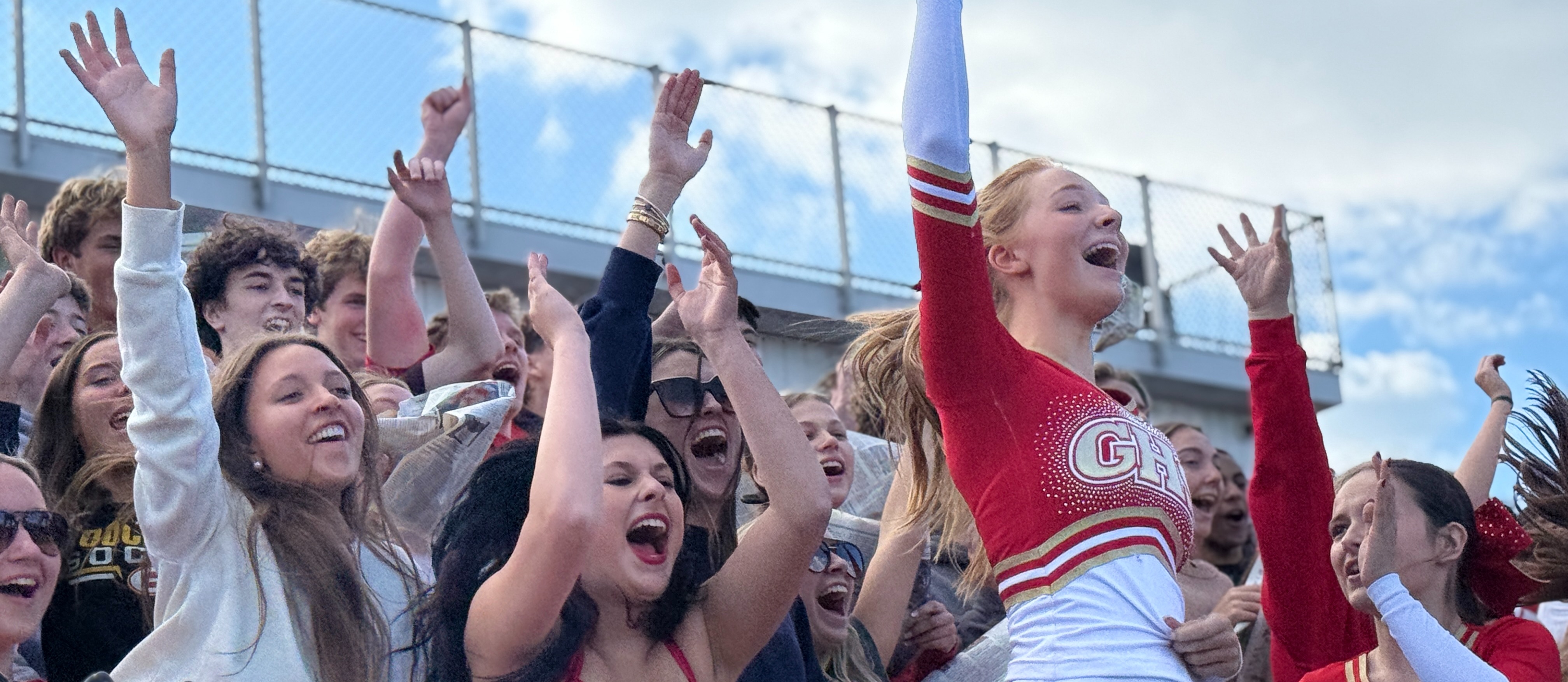 students cheering in stands