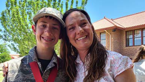 kid and teacher smiling