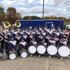 Gobles marching band group photo with new trailer
