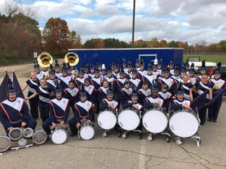 marching-band-group-photo-with-new-trailer