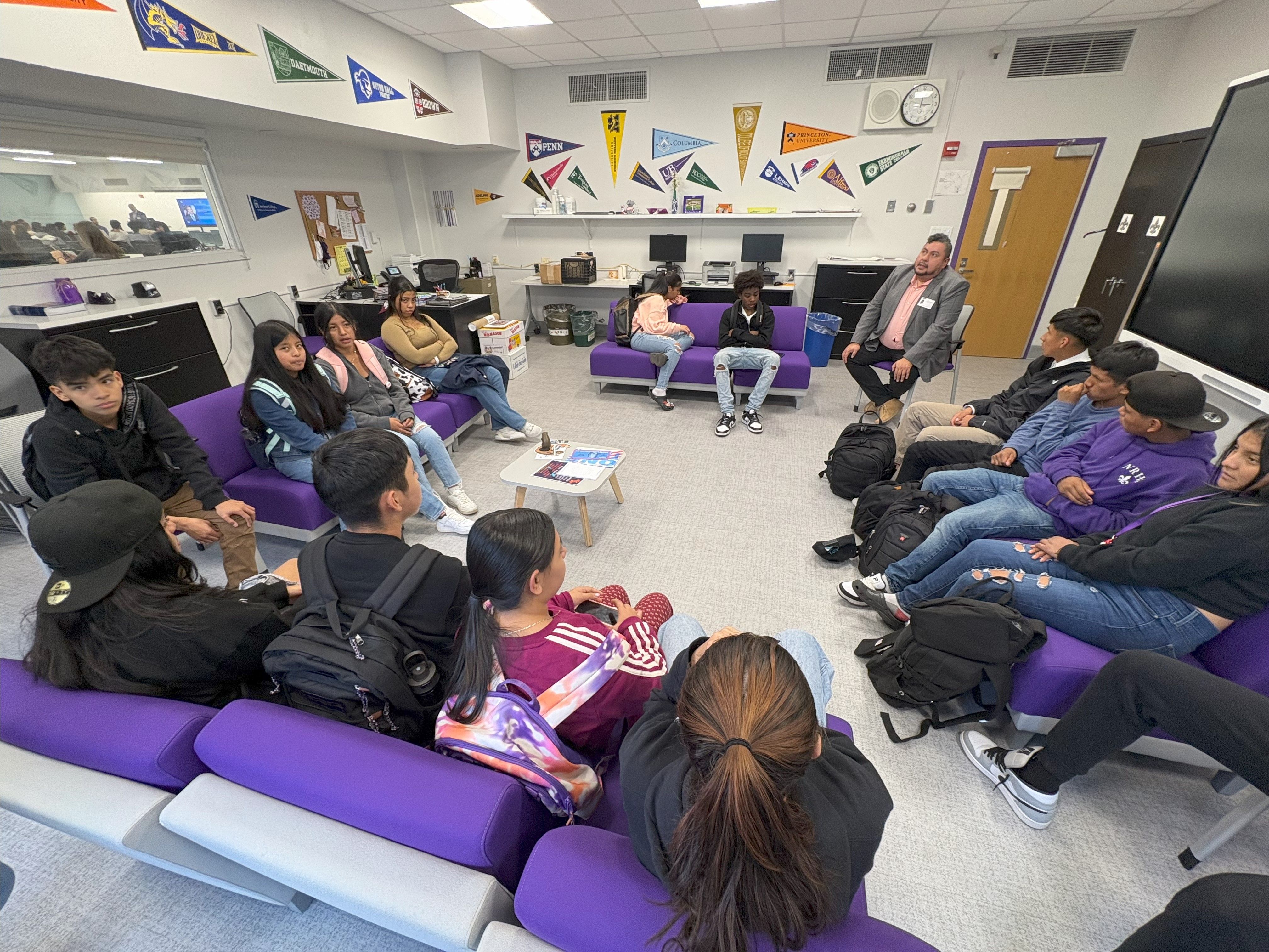 New Rochelle Director of Diversity & Inclusion, Sam Gomez, speaks with NRHS Students in the College & Career Center