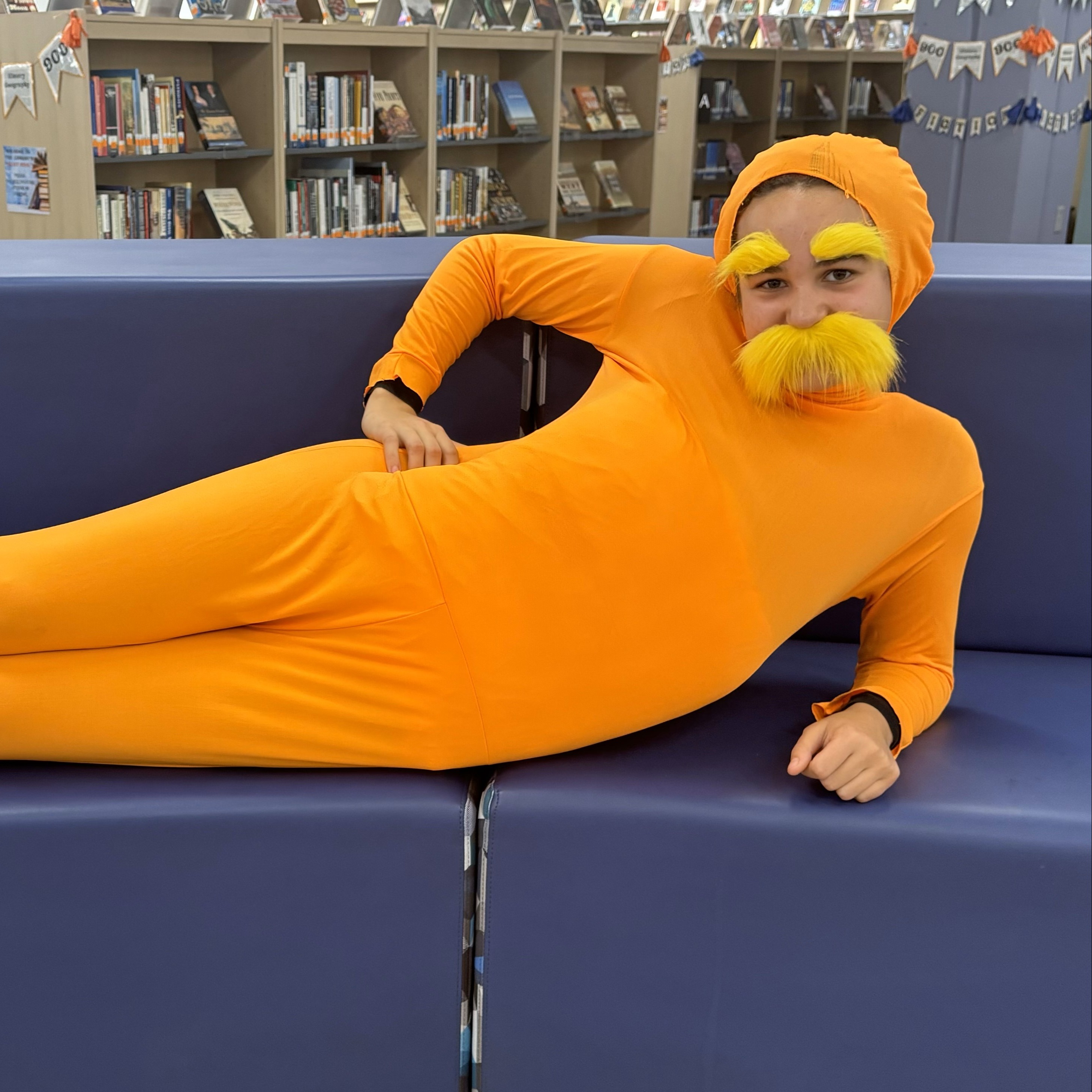 Student dressed in a Lorax Halloween Costume