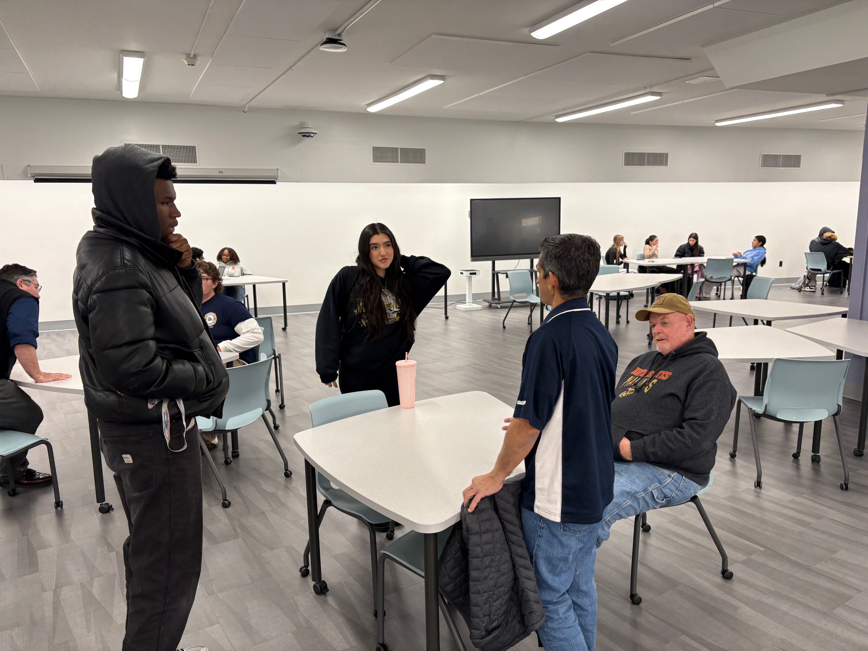 Students speaking with New Rochelle Military Veterans for Veterans Day