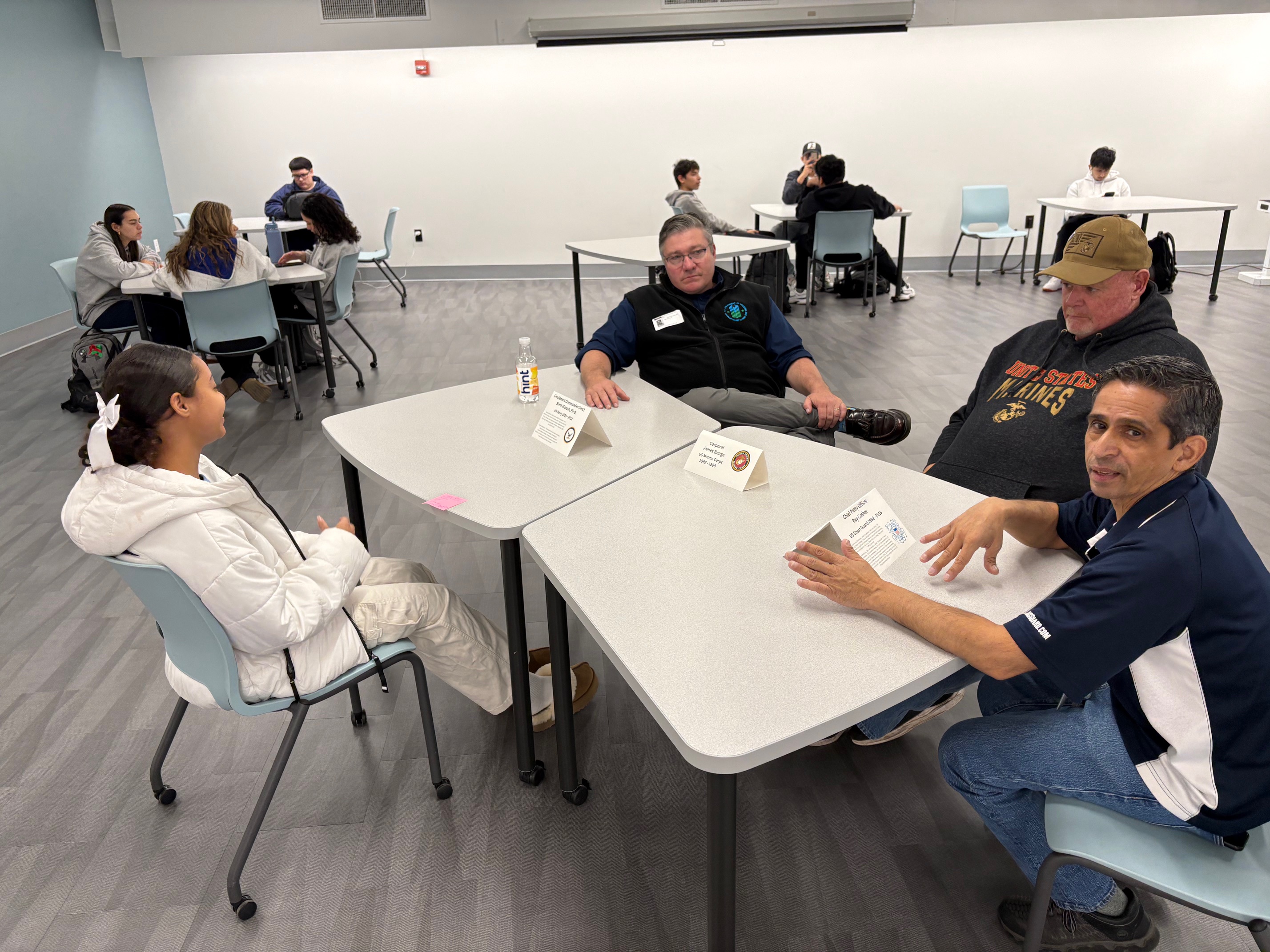 Students speaking with New Rochelle Military Veterans for Veterans Day