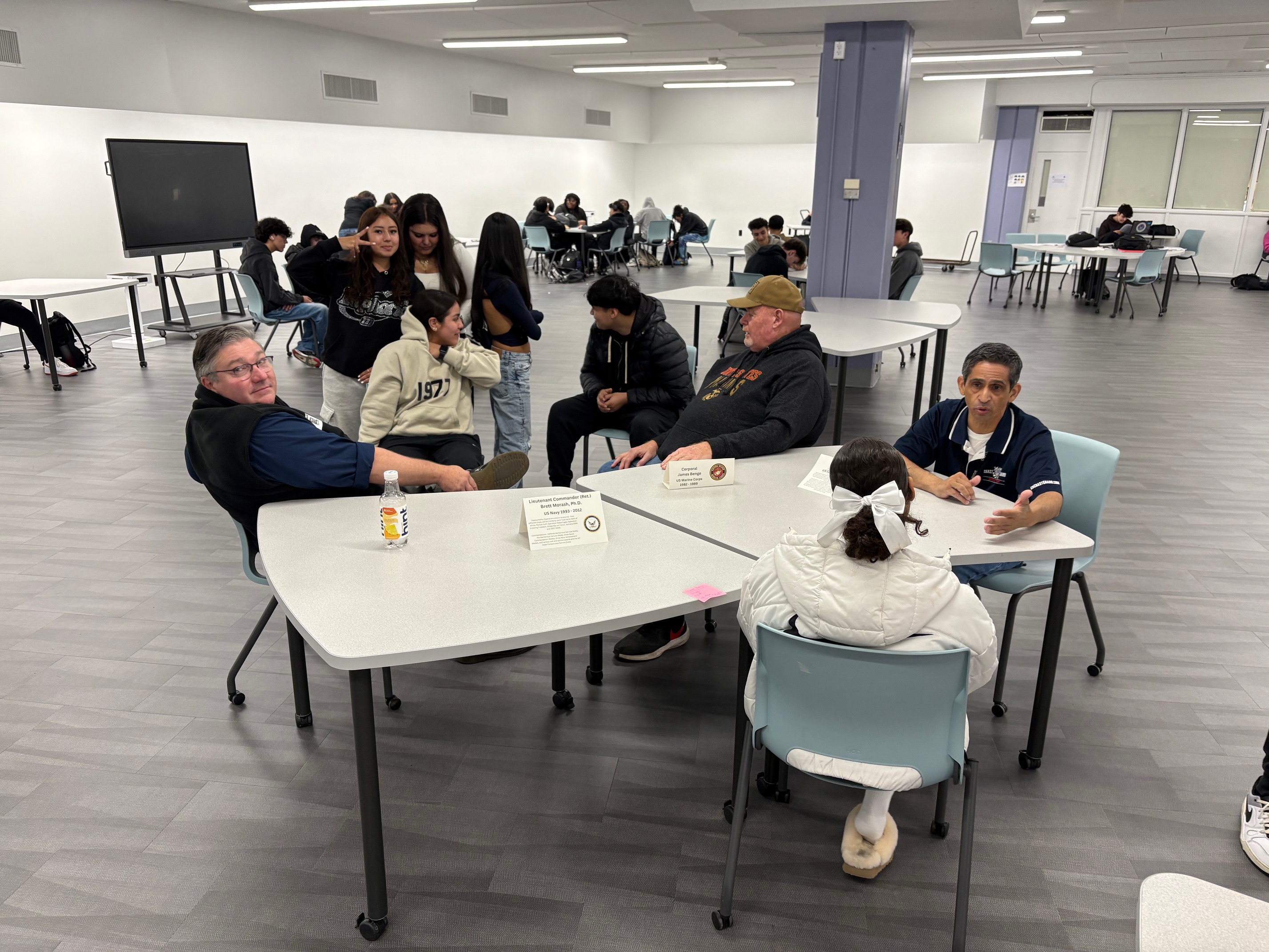 Students speaking with New Rochelle Military Veterans for Veterans Day