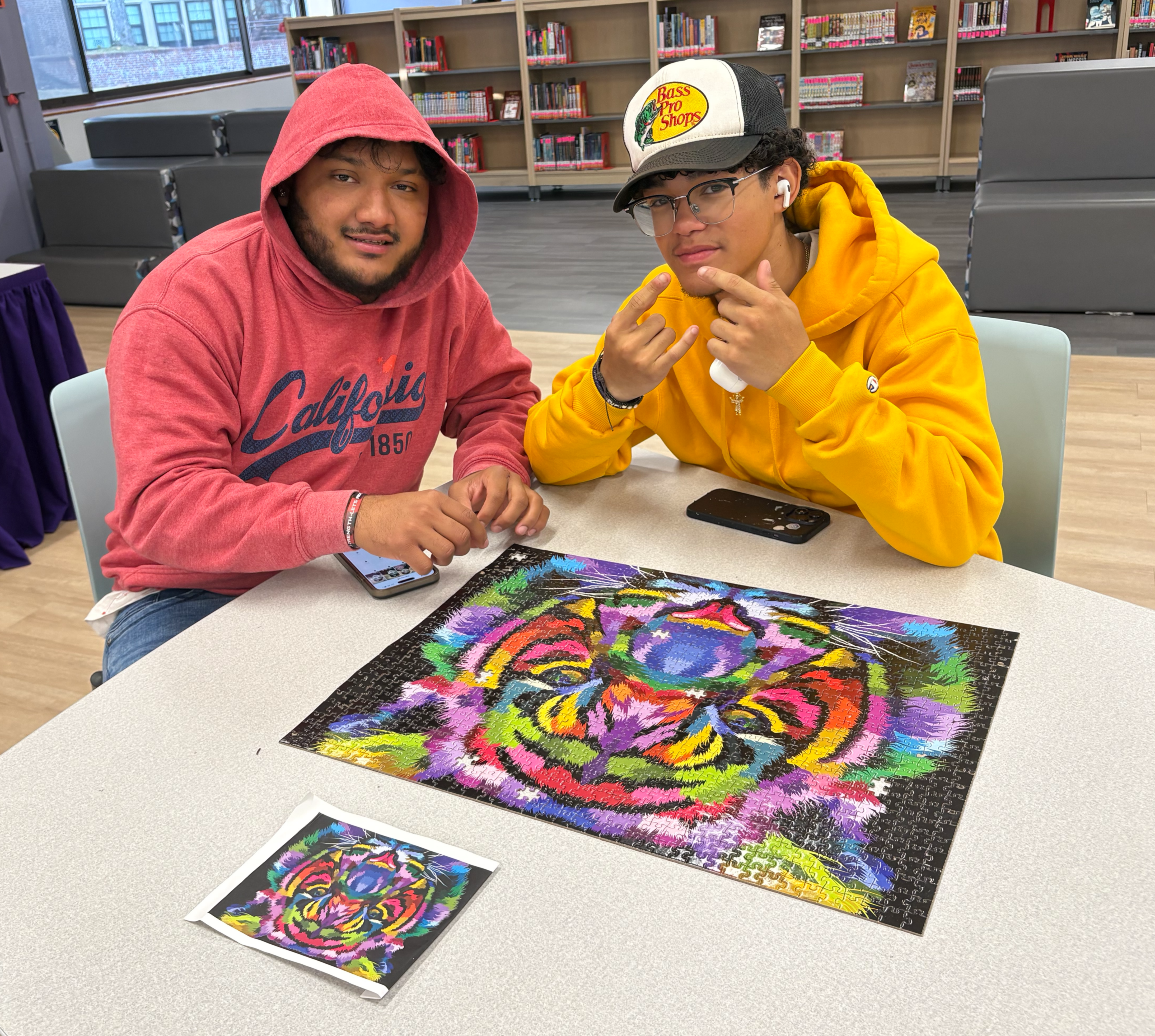 Students standing with completed Puzzle