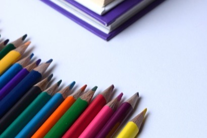 Colored pencils and books