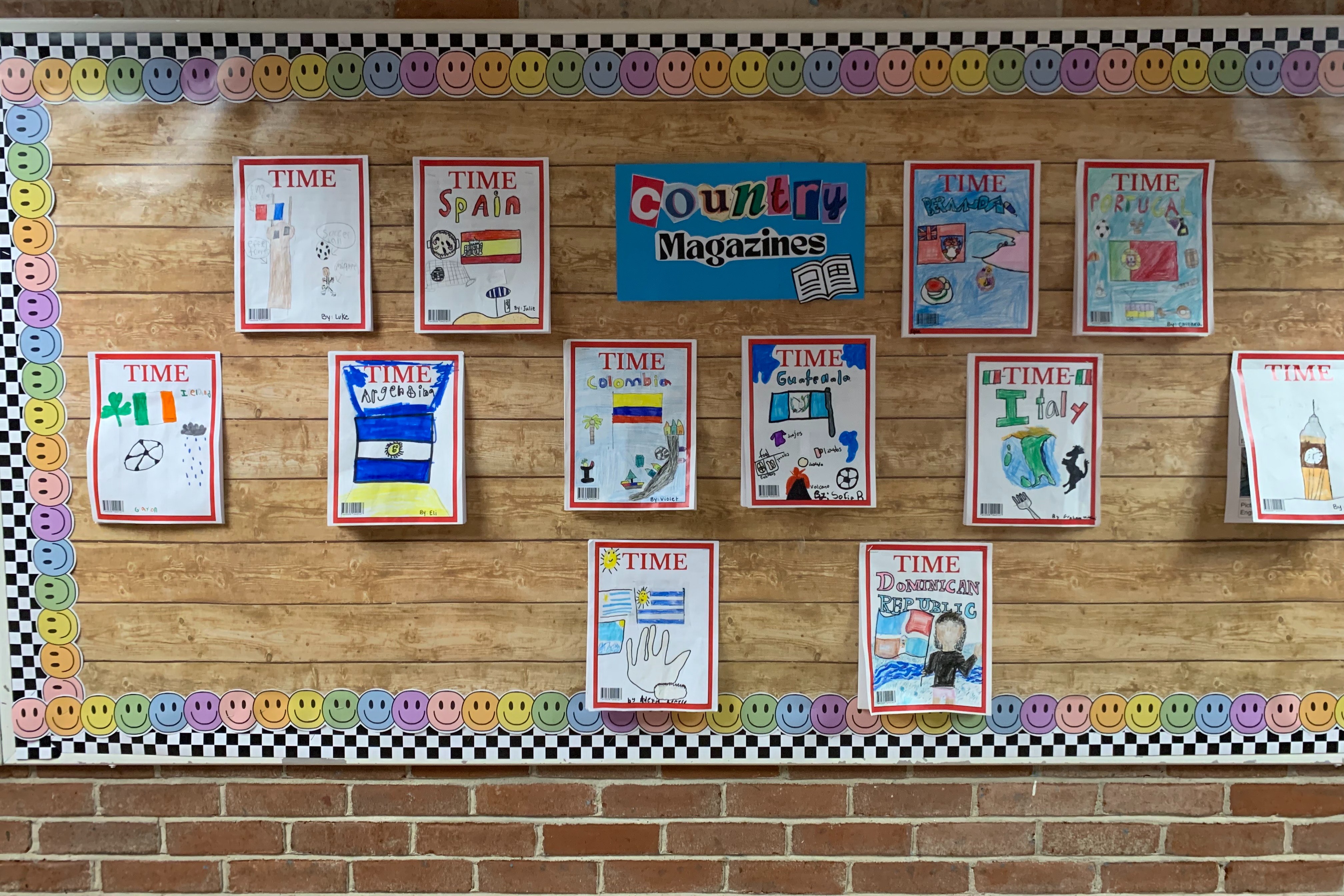 Student projects of country magazines hanging on bulletin board