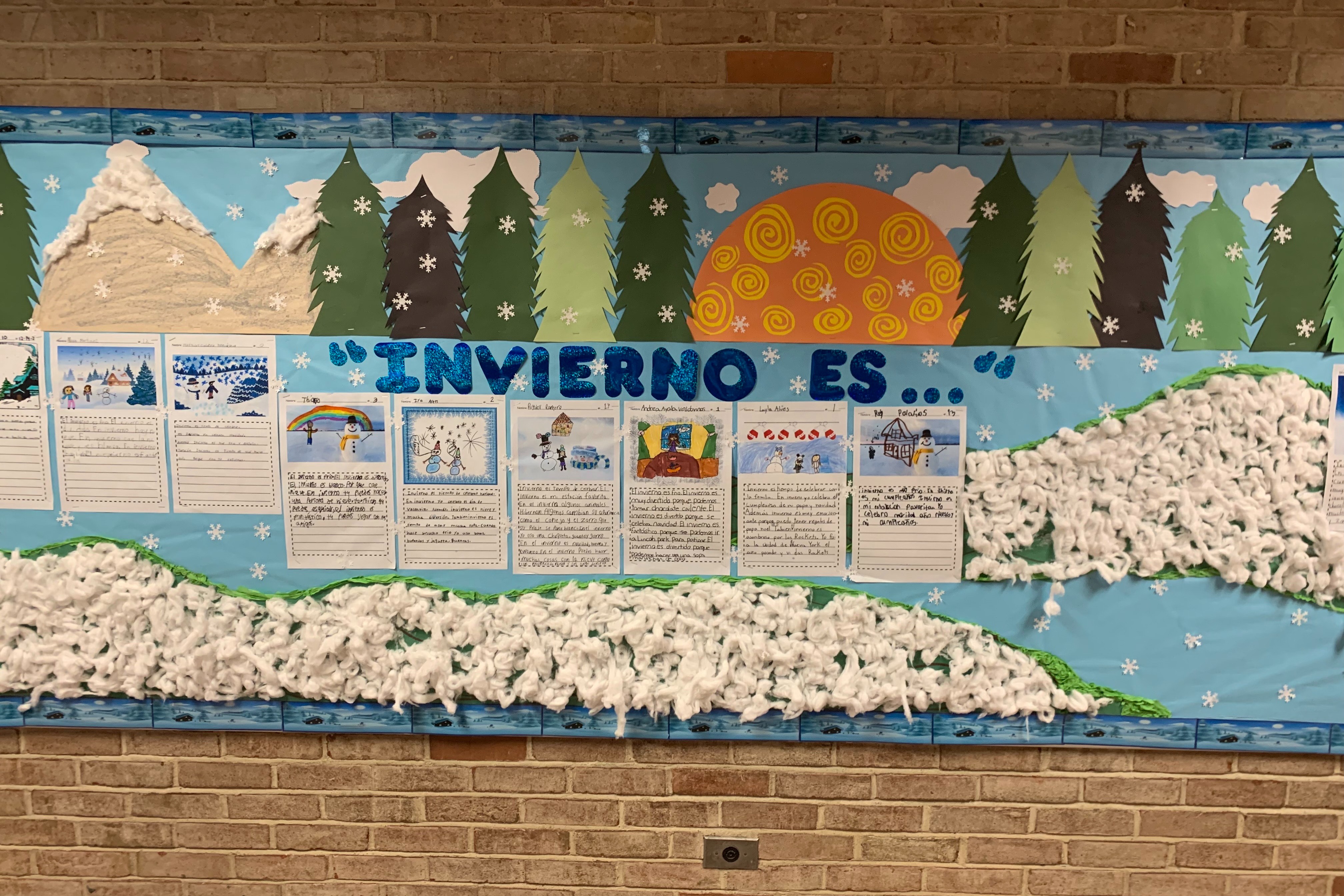 Student bulletin board with writing pieces displayed