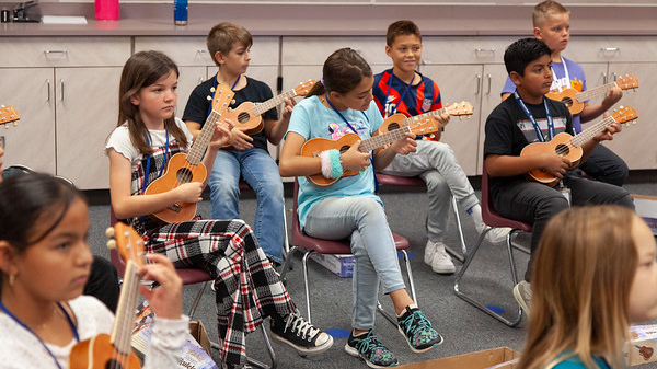 students playing eukulele