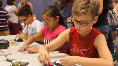 3 students working puzzles