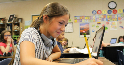 6th grade girl with laptop