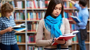 student reading books in library