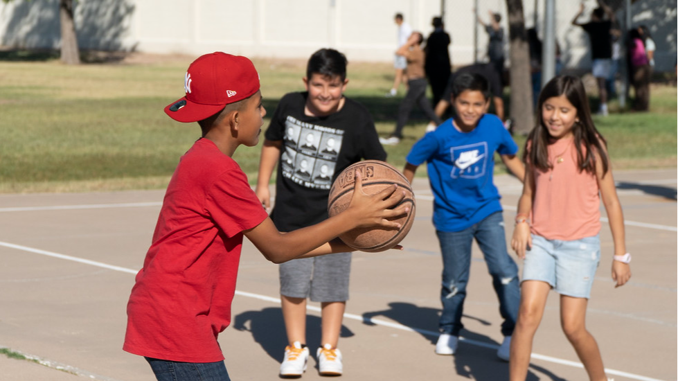 students playing basketball