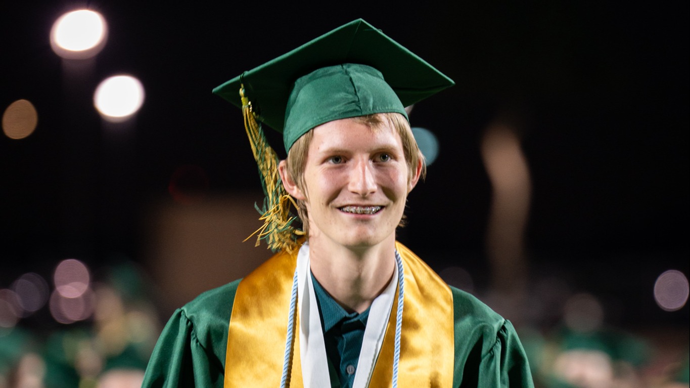 Skyline HS student walking at graduation