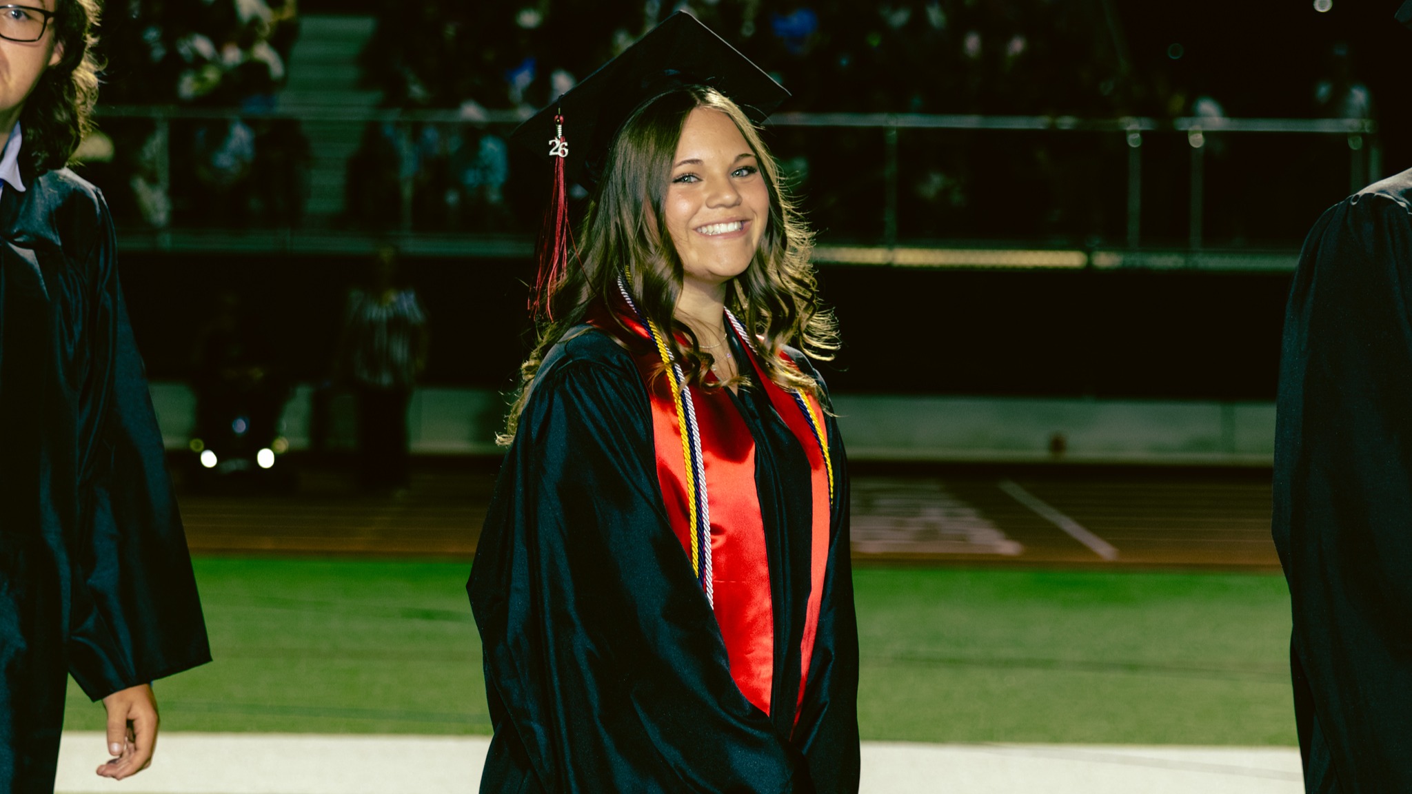 Red Mountain HS student walking at gradulation