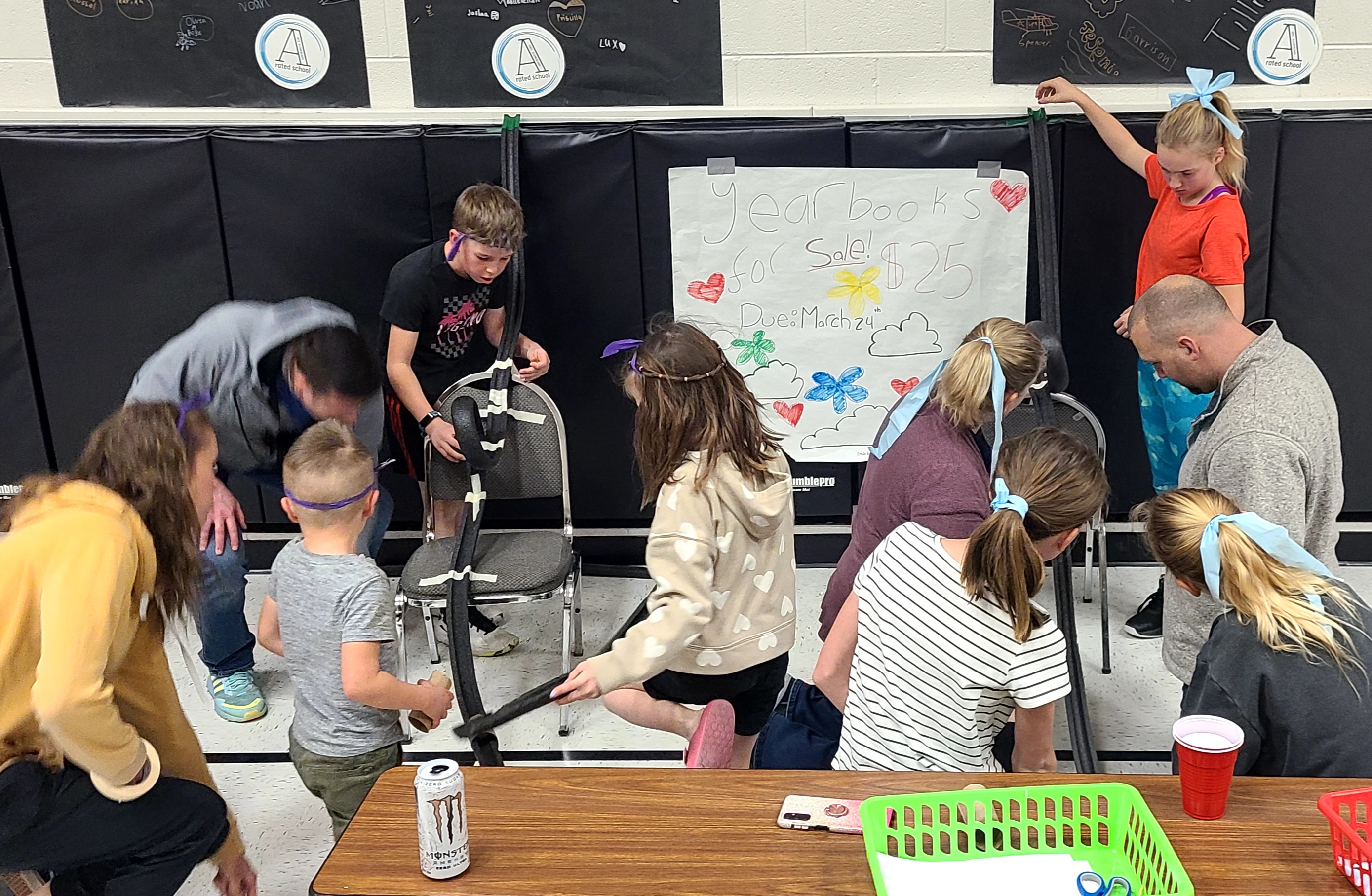 Families building roller coasters at Family STEM Night