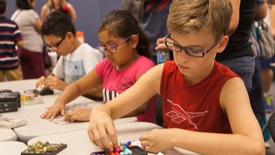 three students working puzzles