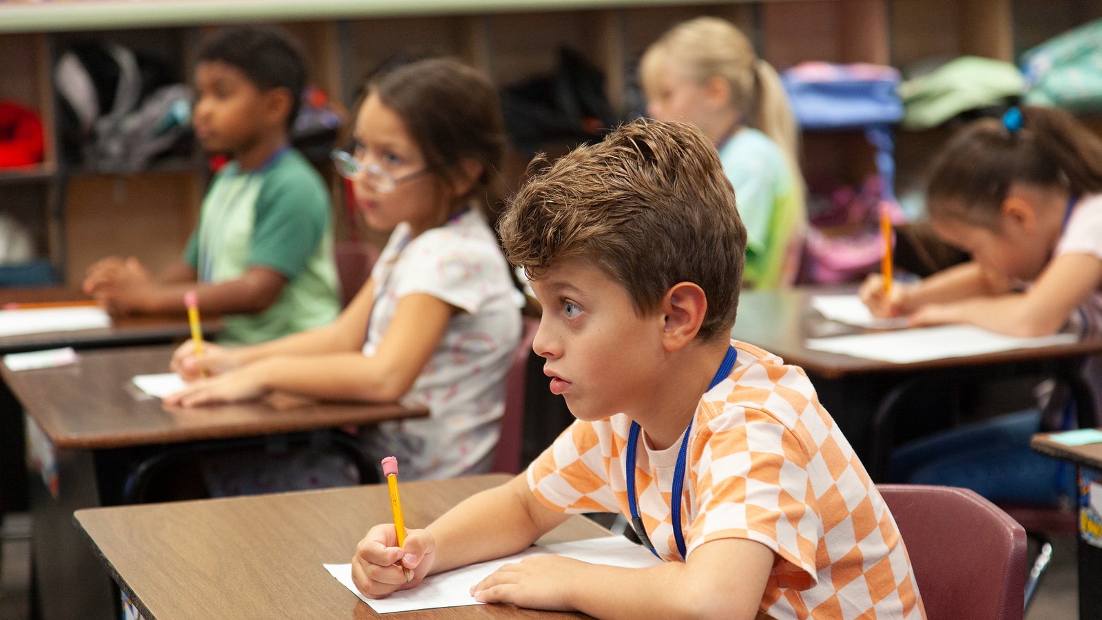 students sitting at desks working