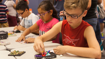 three students working puzzles