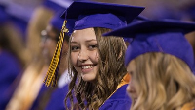 Mesa High stuent sitting at graduation