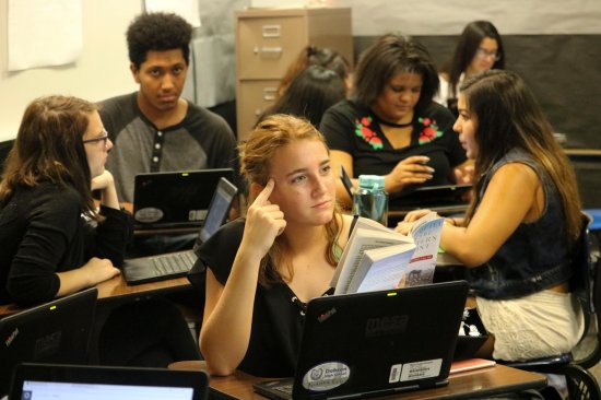 students with books and computers