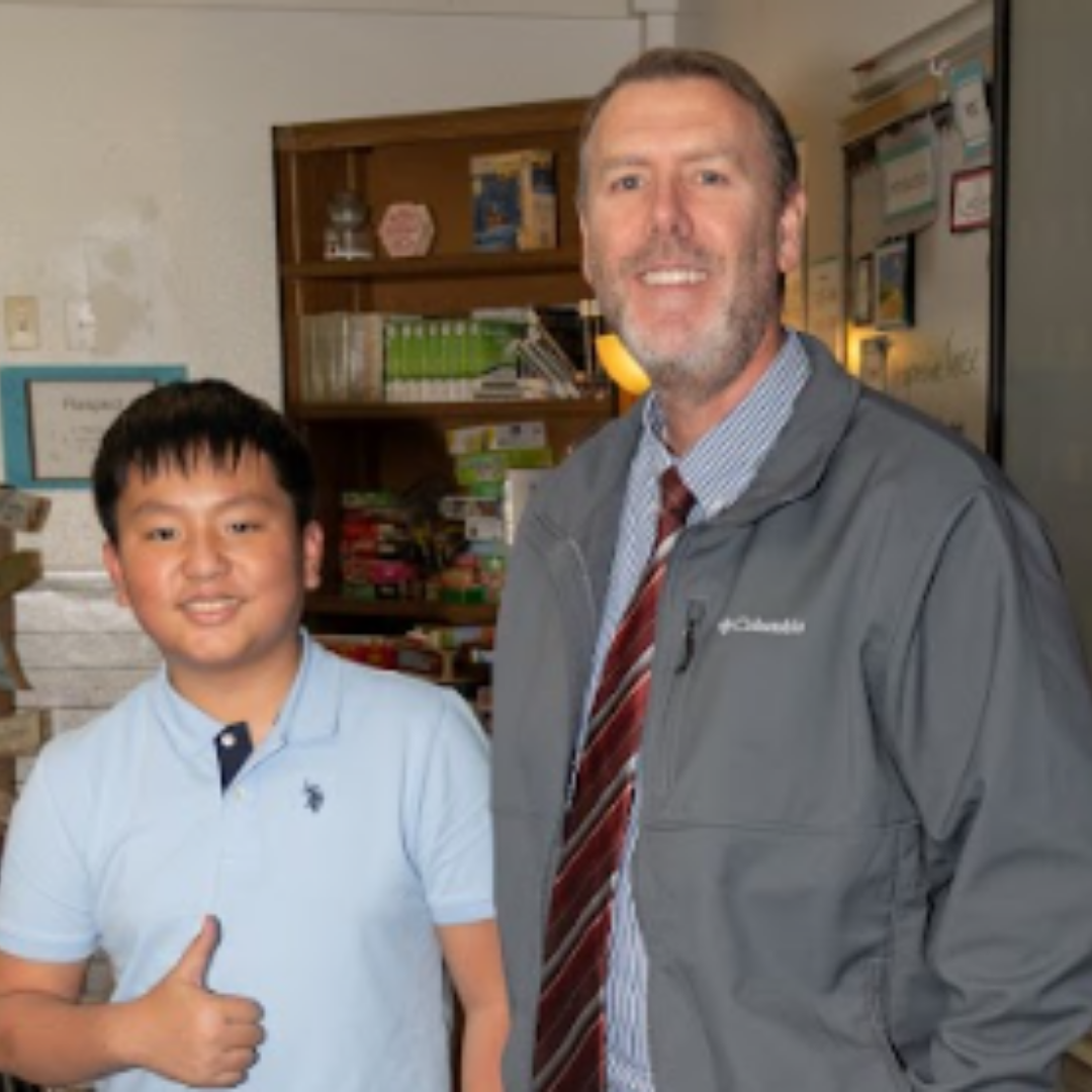 Principal Jeremy Arnett and Student Quan Pham