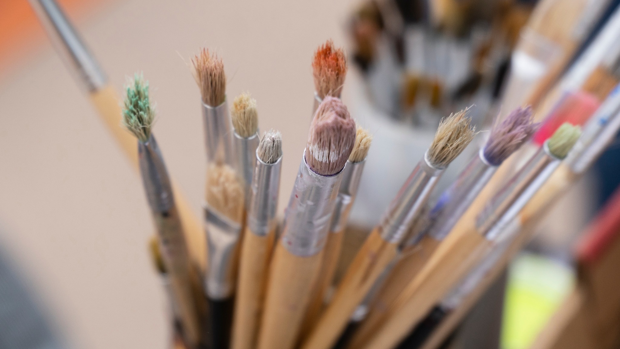 paint brushes in a cup