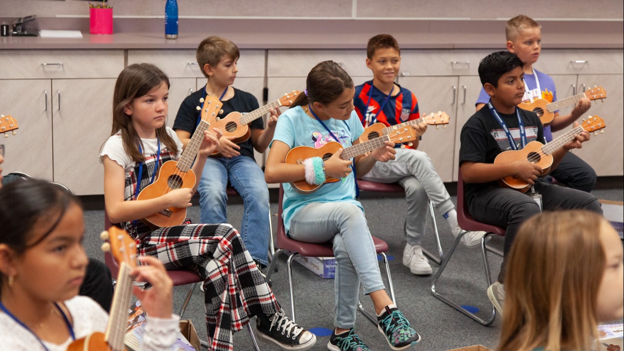 students playing eukulele