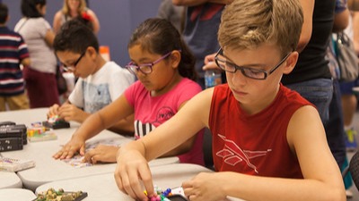 three students working puzzles