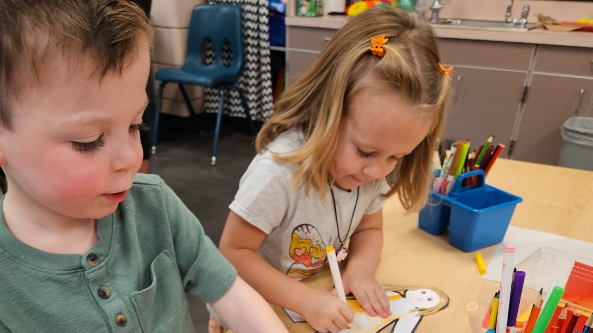 two students drawing