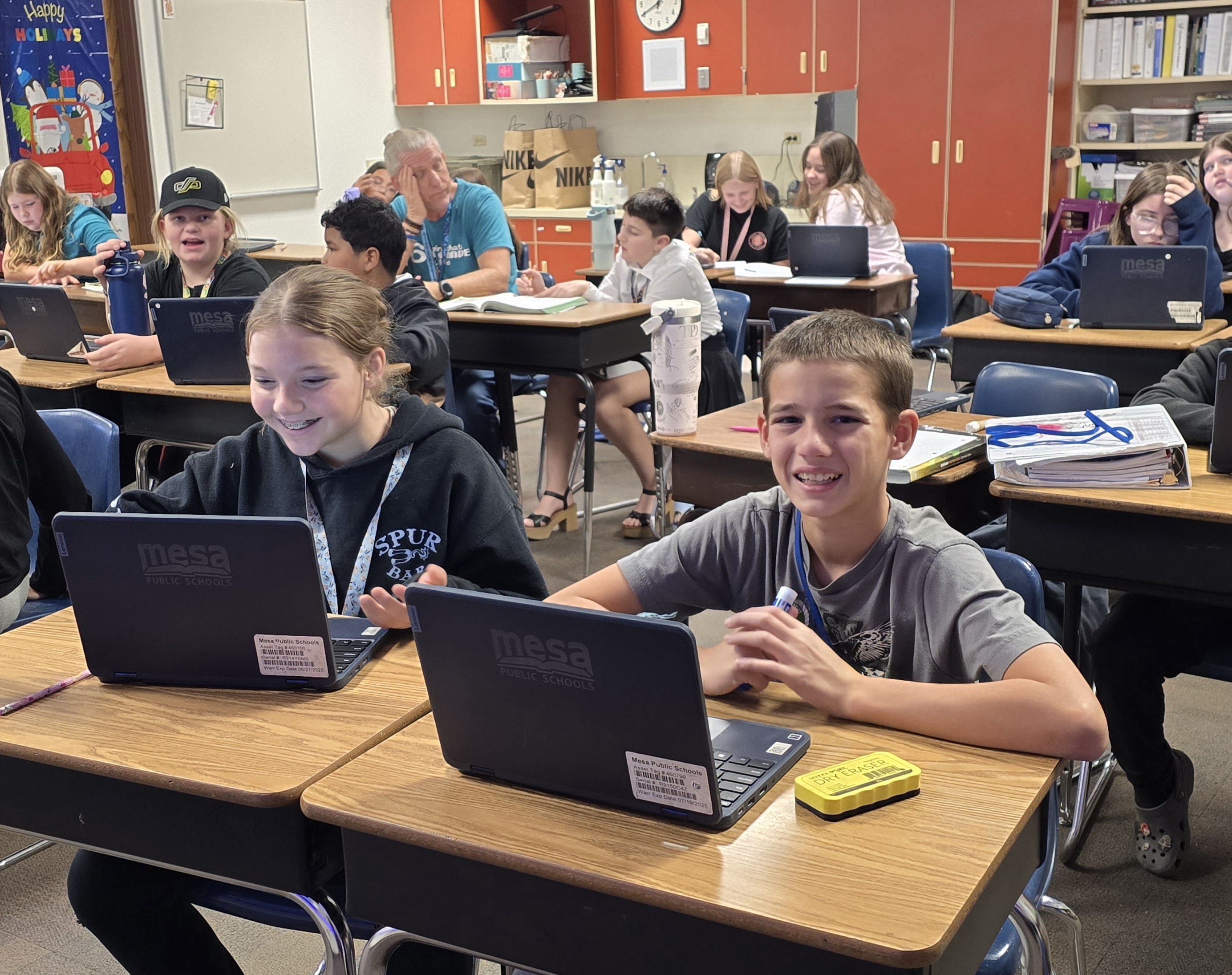 Sixth-grade students working on an online assingment.