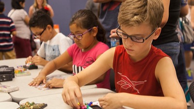 three students working puzzles