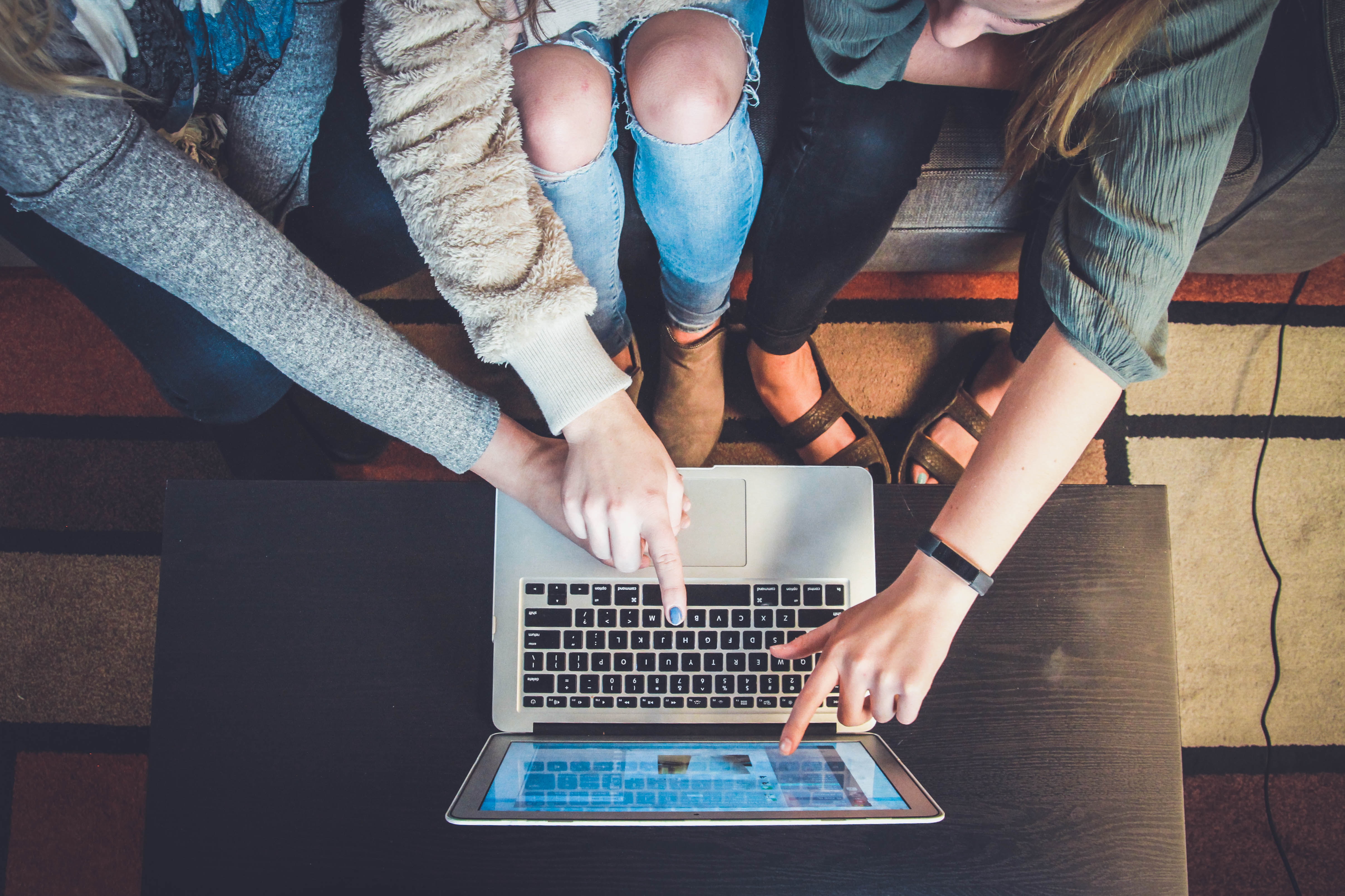A family gathered around a computer