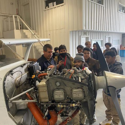 Students learning about plane