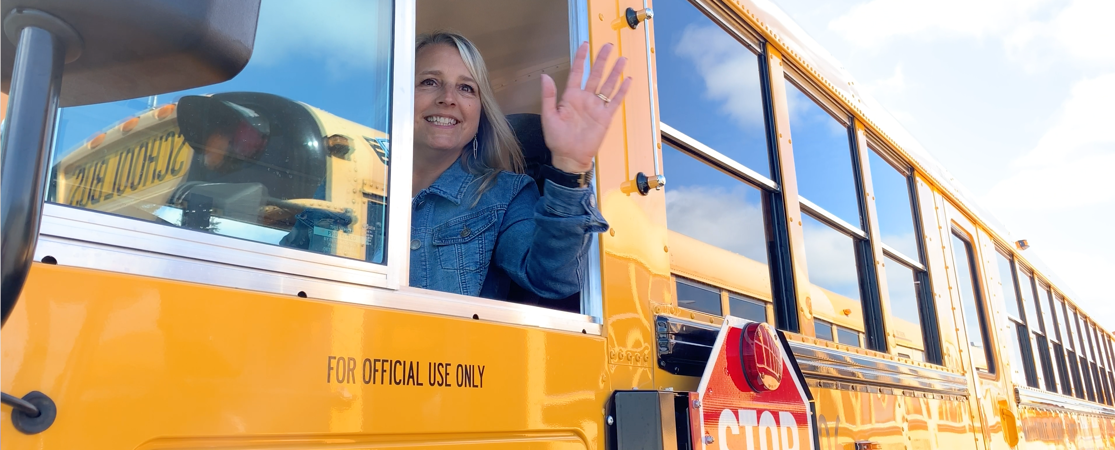 Yellow School Bus in front of the school