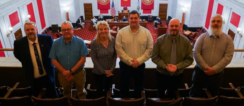 West Virginia School Service Personnel Association Executive Director Joe White invite several school custodians to the Senate Chamber of the State Capital to be recognized for their service to their school communities
