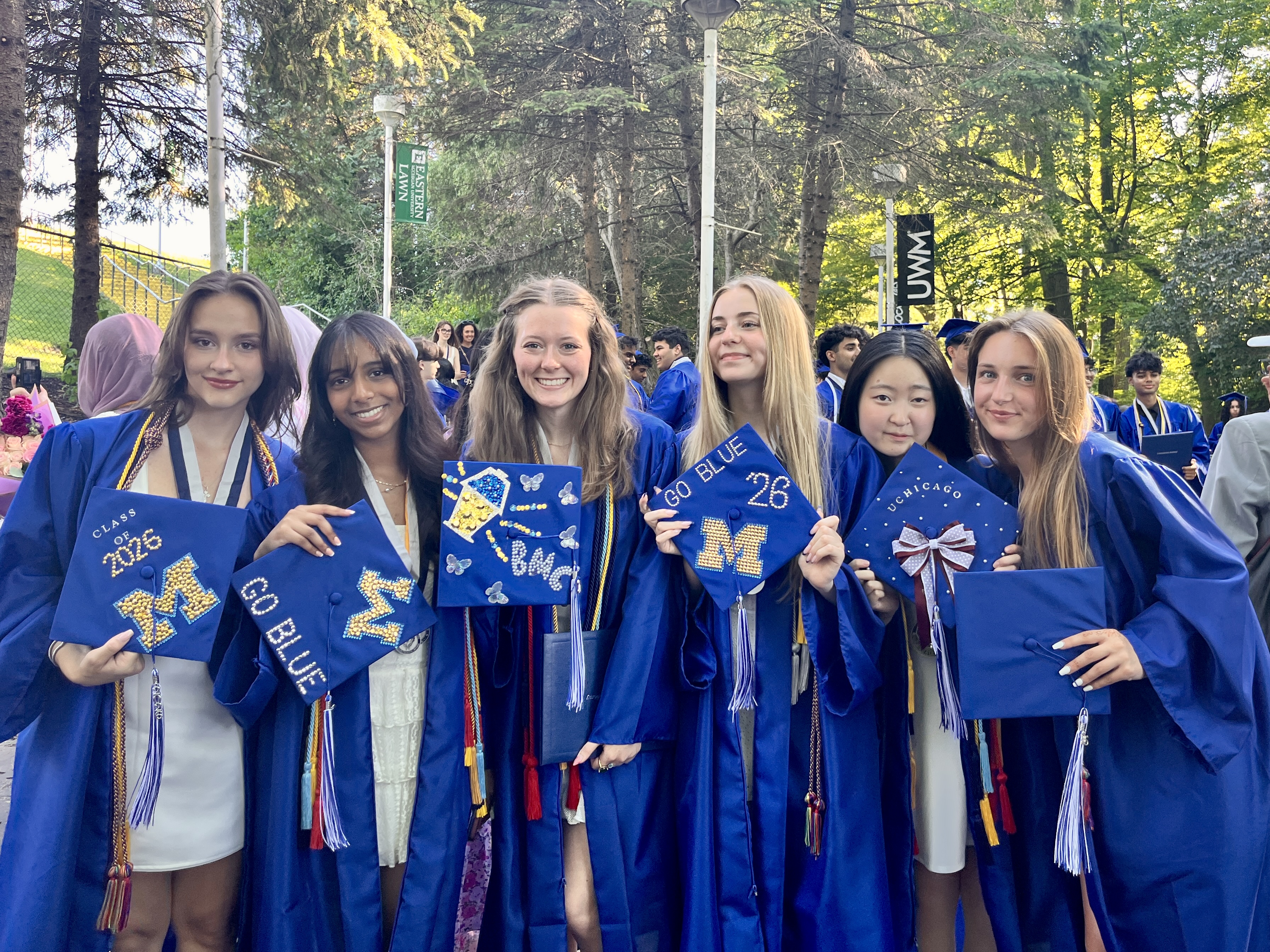 photo of students in cap and gown at graduation ceremony