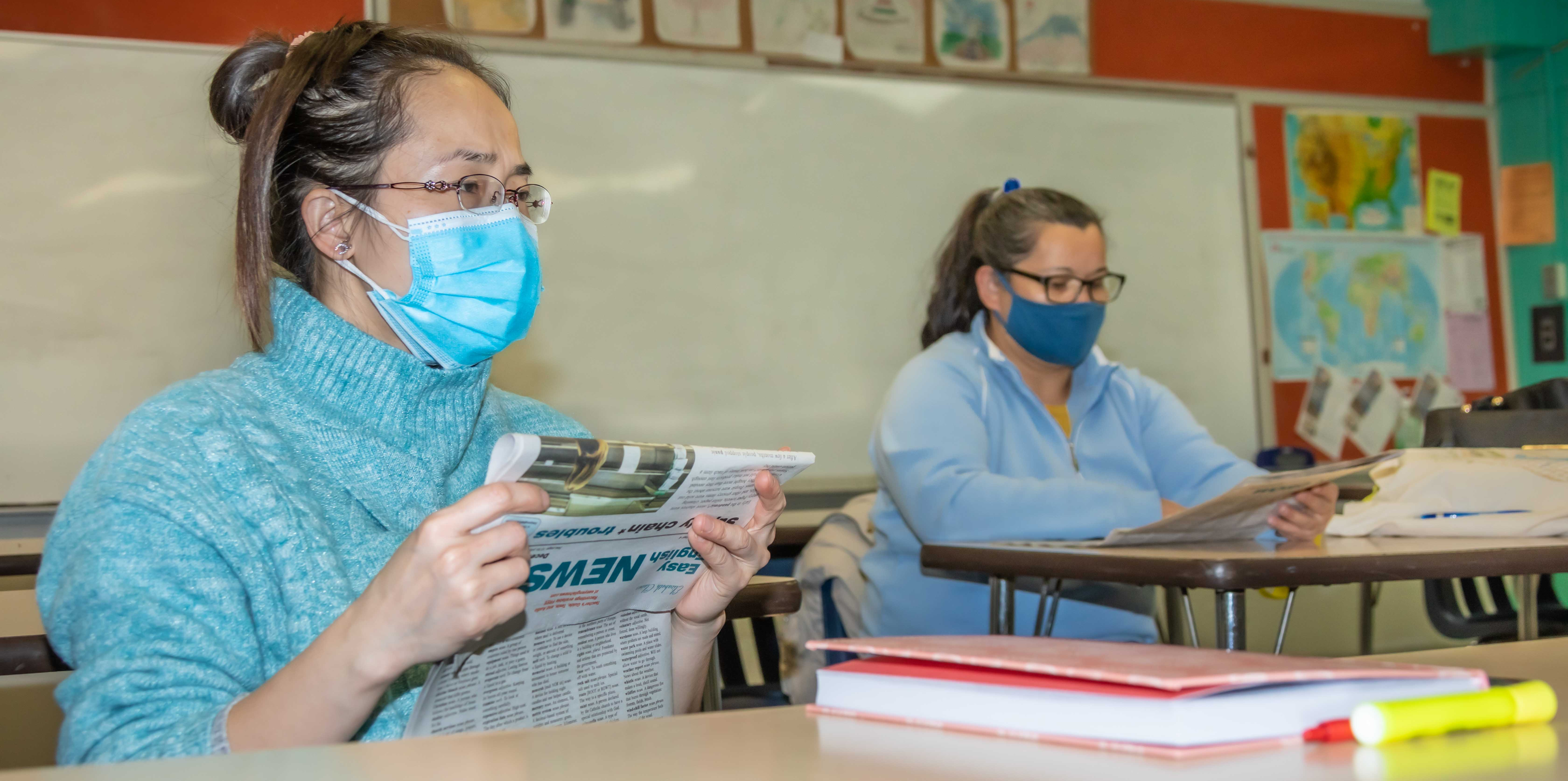 ESL students working on an article