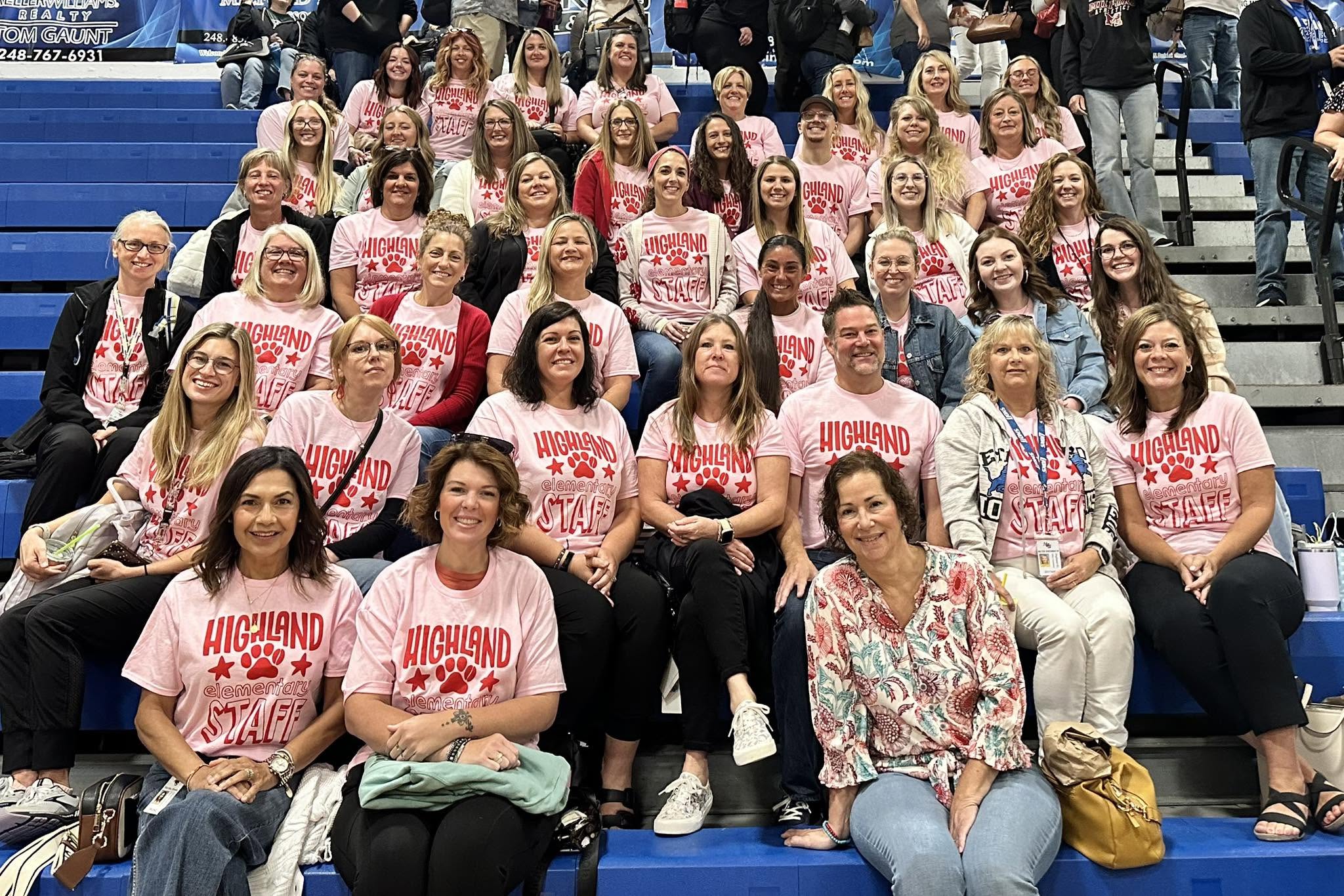 group photo of teachers smiling and posing 