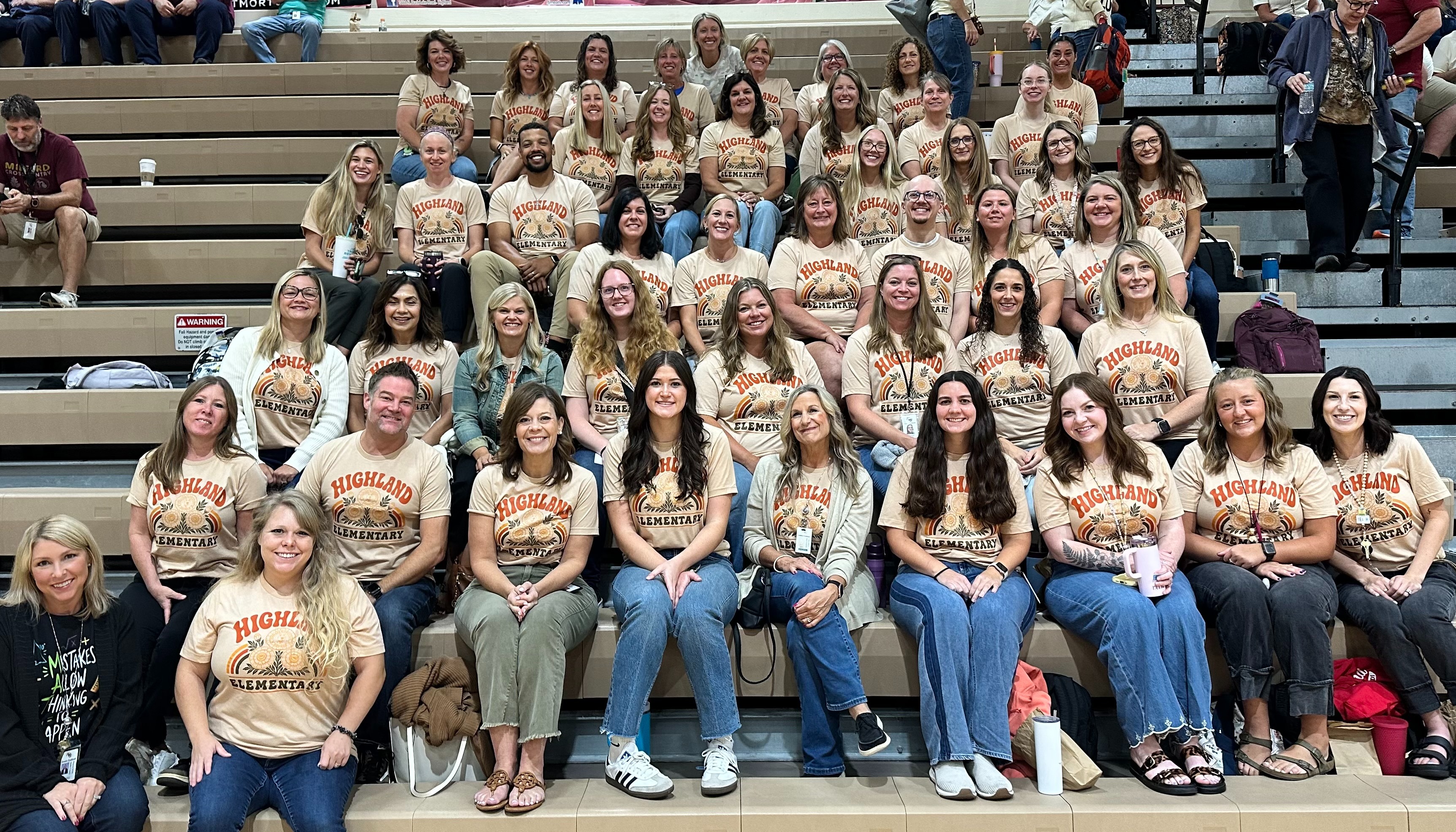 group photo of teachers smiling and posing 