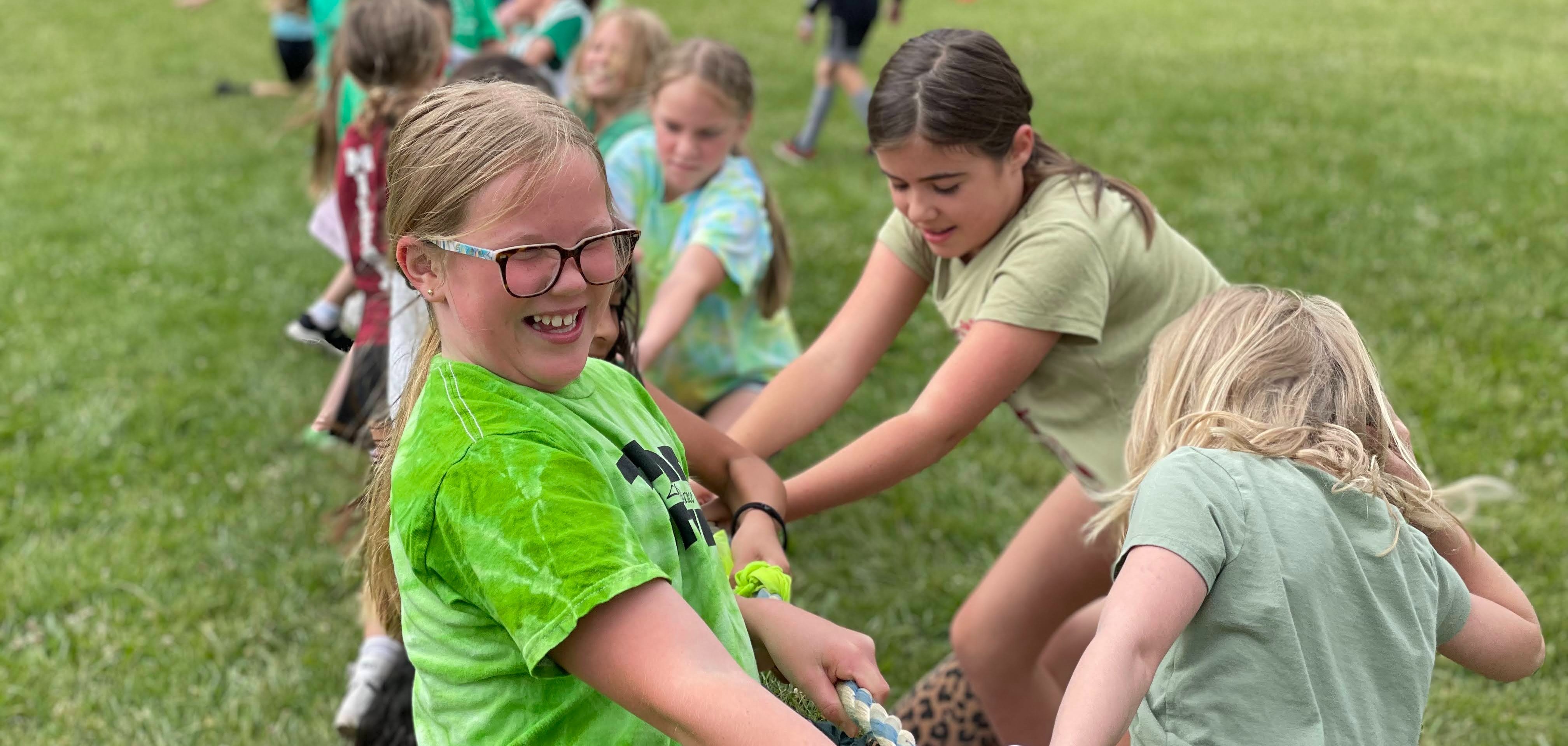 Girls pulling on a tug of war on field day