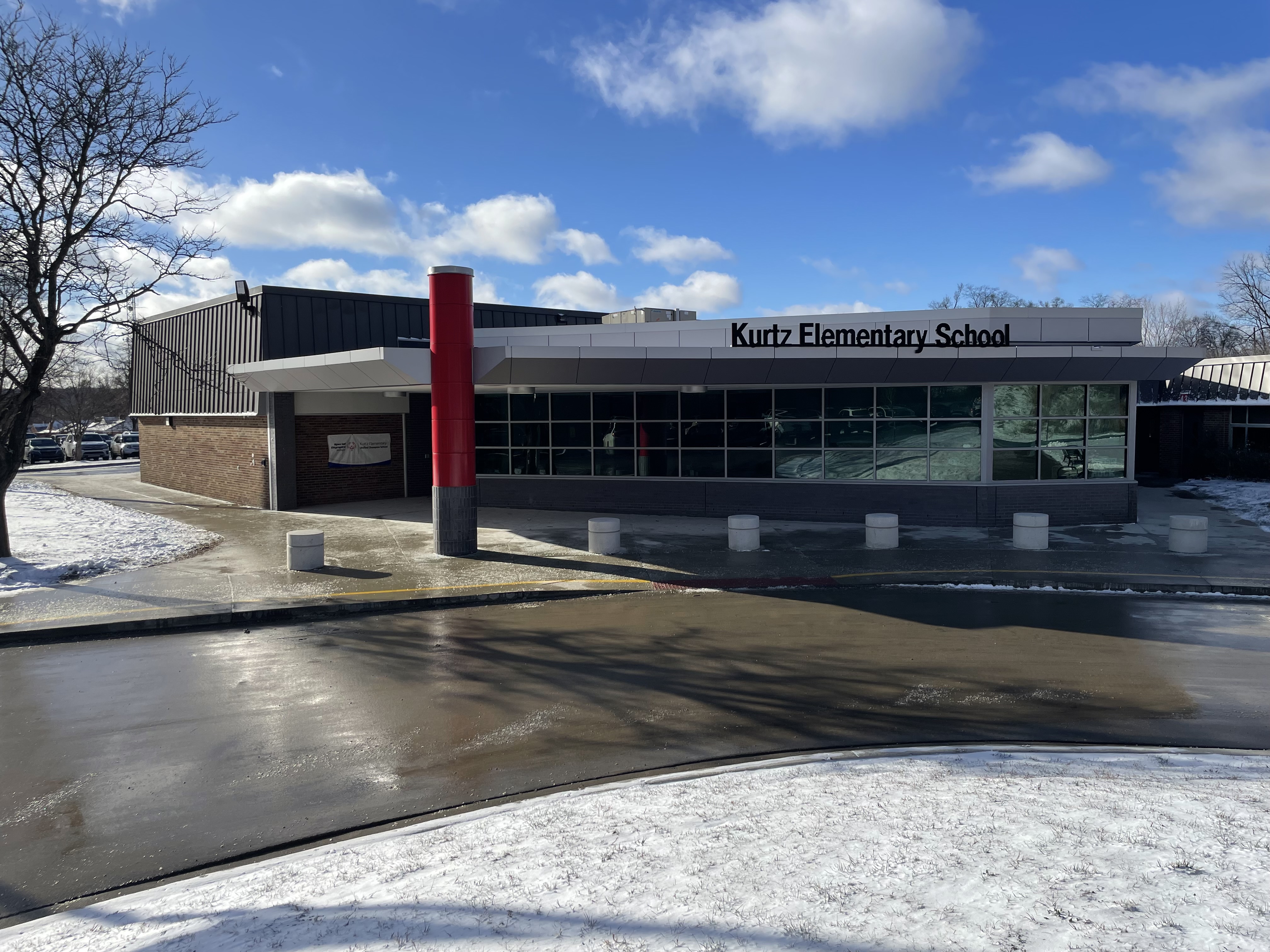 The front of Kurtz Elementary with snow and sunshine.