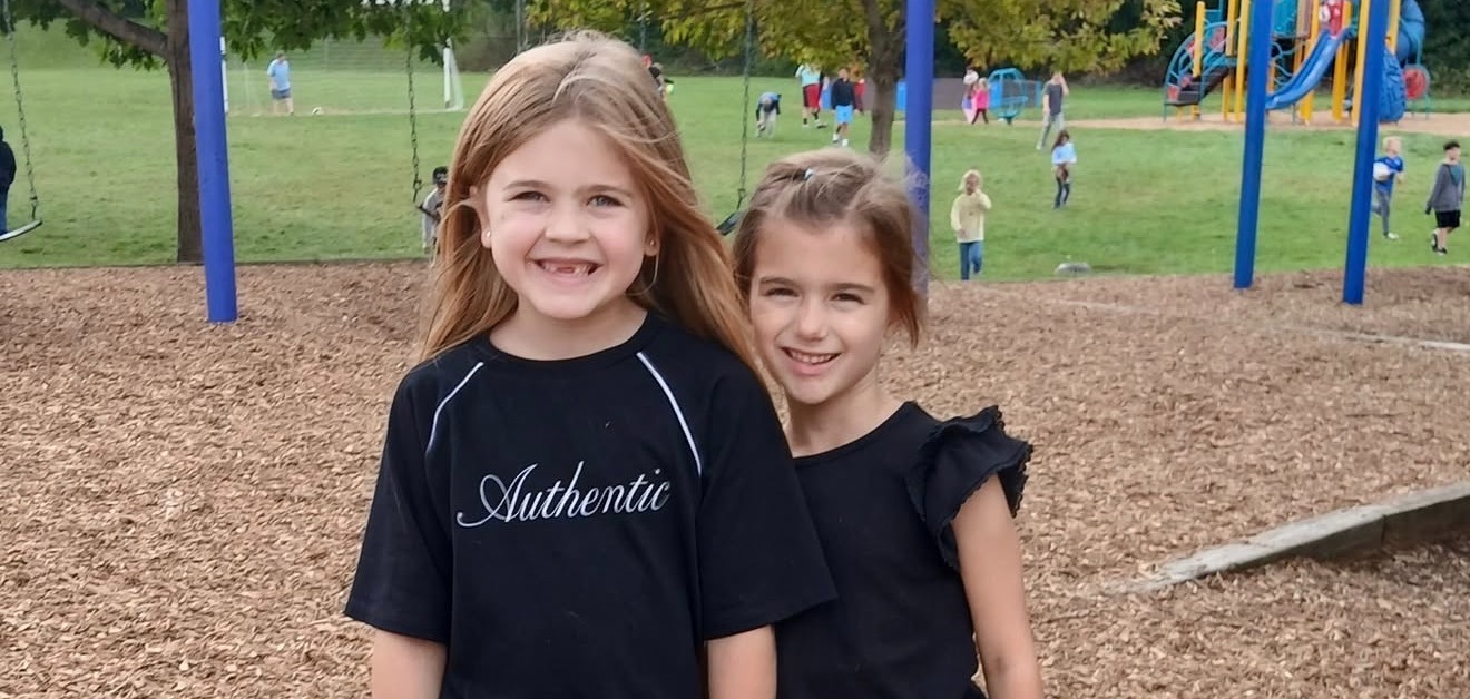 two first grade students outside