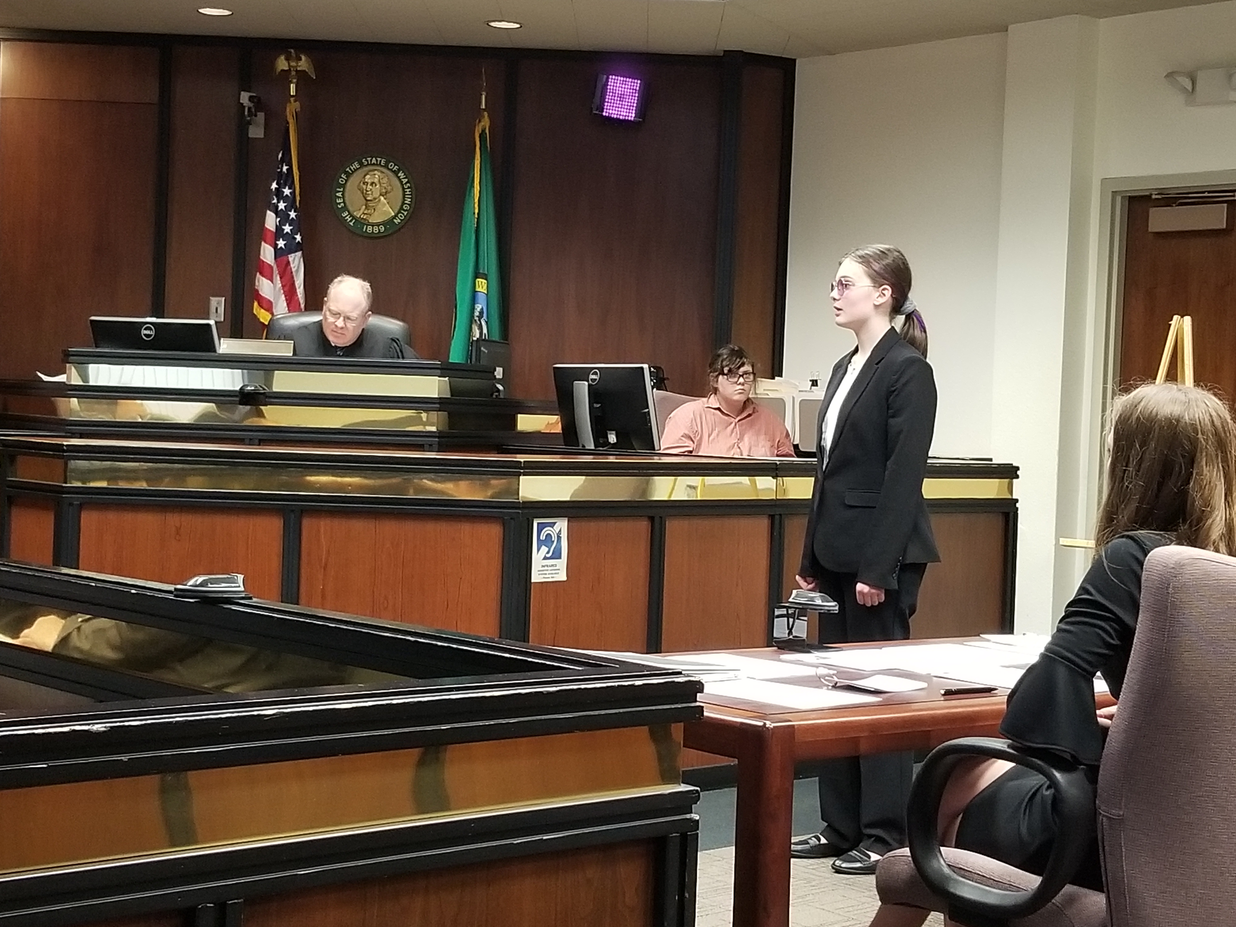 A photo of a group of students in a mock trial