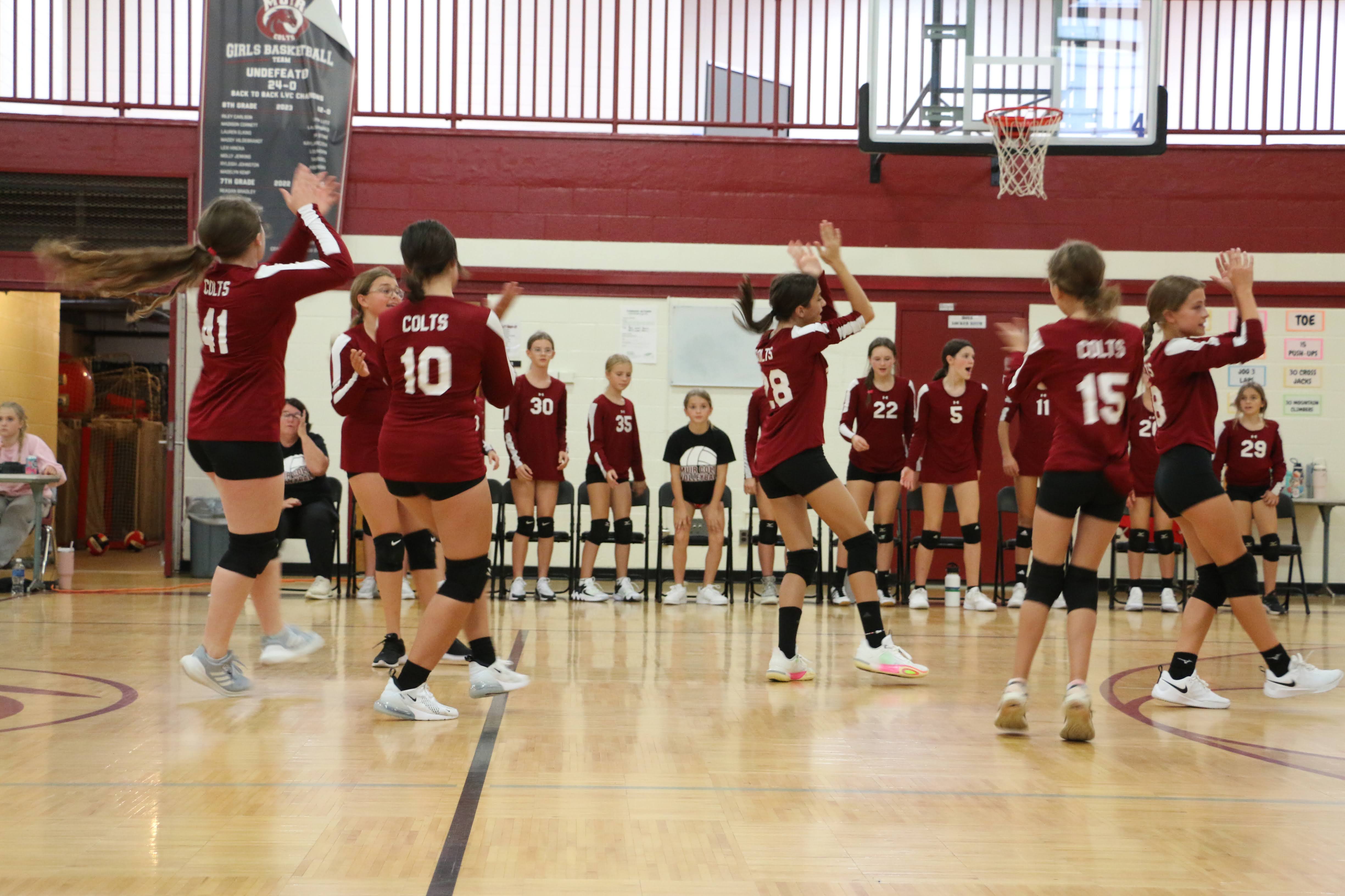 7th grade Girls Volleyball cheering for a great shot