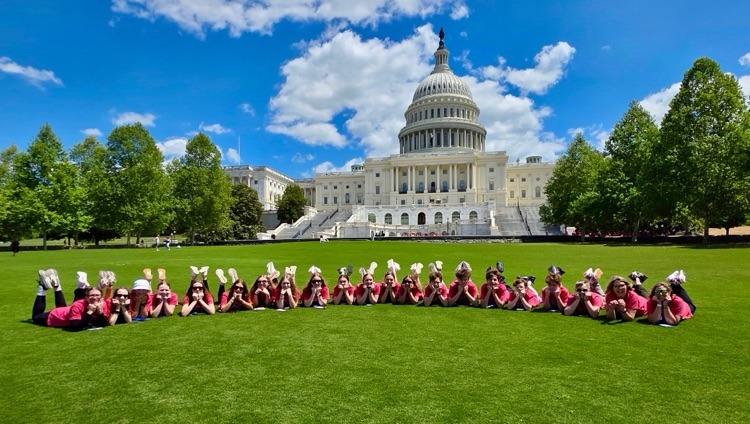 students pose for photo at monument in DC